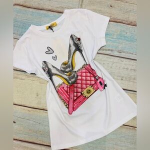 White Graphic Tee with Pink Quilted Bag & Black Heels